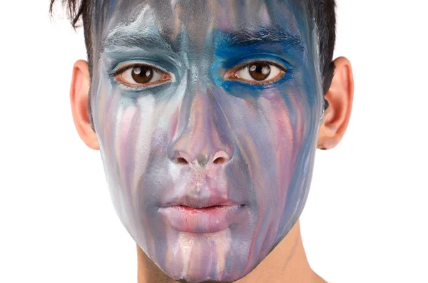 Mooie jonge man geschilderd op het gezicht — Stockfoto