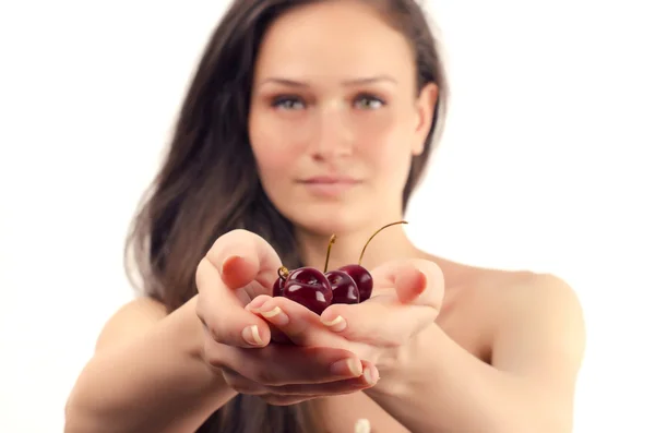 Beautiful woman posing with a cherry — Stock Photo, Image