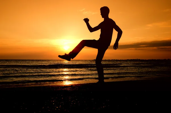 Man shadow enjoying the sunrise — Stock Photo, Image