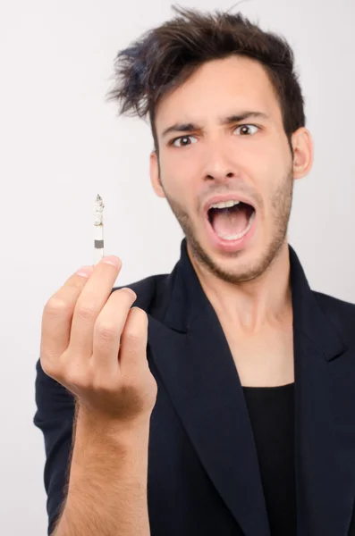 Young beautiful businessman quiting smoking — Stock Photo, Image