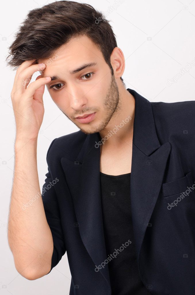 Young beautiful businessman stressed at work