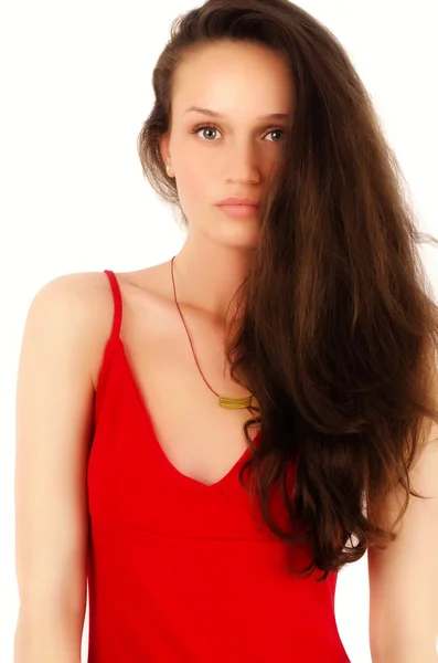 Mooie brunette vrouw in jurk poseren mode in studio — Stockfoto