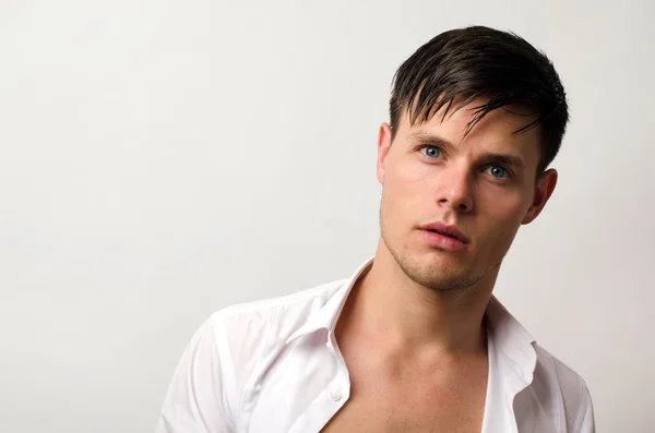 Portrait of a beautiful man posing fashion in a studio — Stock Photo, Image