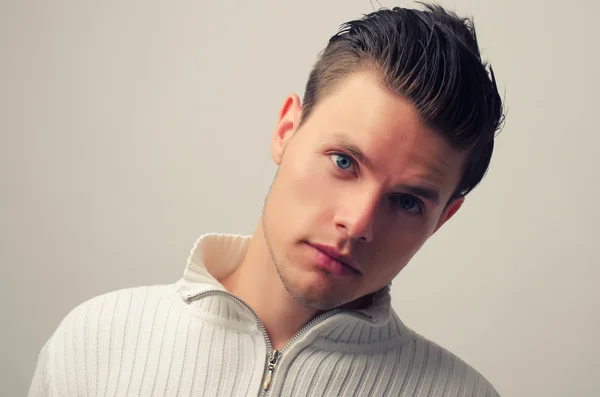 Portrait of a beautiful man posing fashion in a studio — Stock Photo, Image