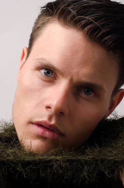 Portrait of a beautiful man posing fashion in a studio — Stock Photo, Image