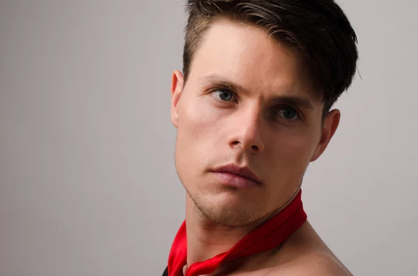 Portrait of a beautiful man posing fashion in a studio — Stock Photo, Image