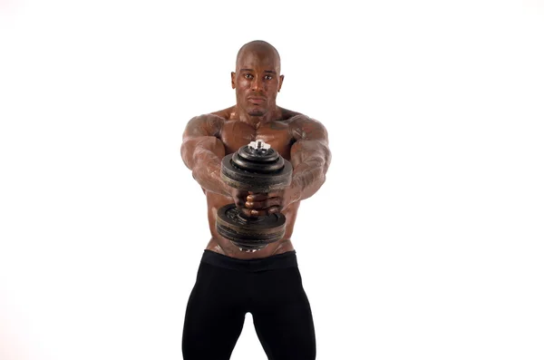 Black bodybuilder training with dumbbells. Strong man with perfect abs, shoulders,biceps, triceps and chest. Isolated on white background — Stock Photo, Image