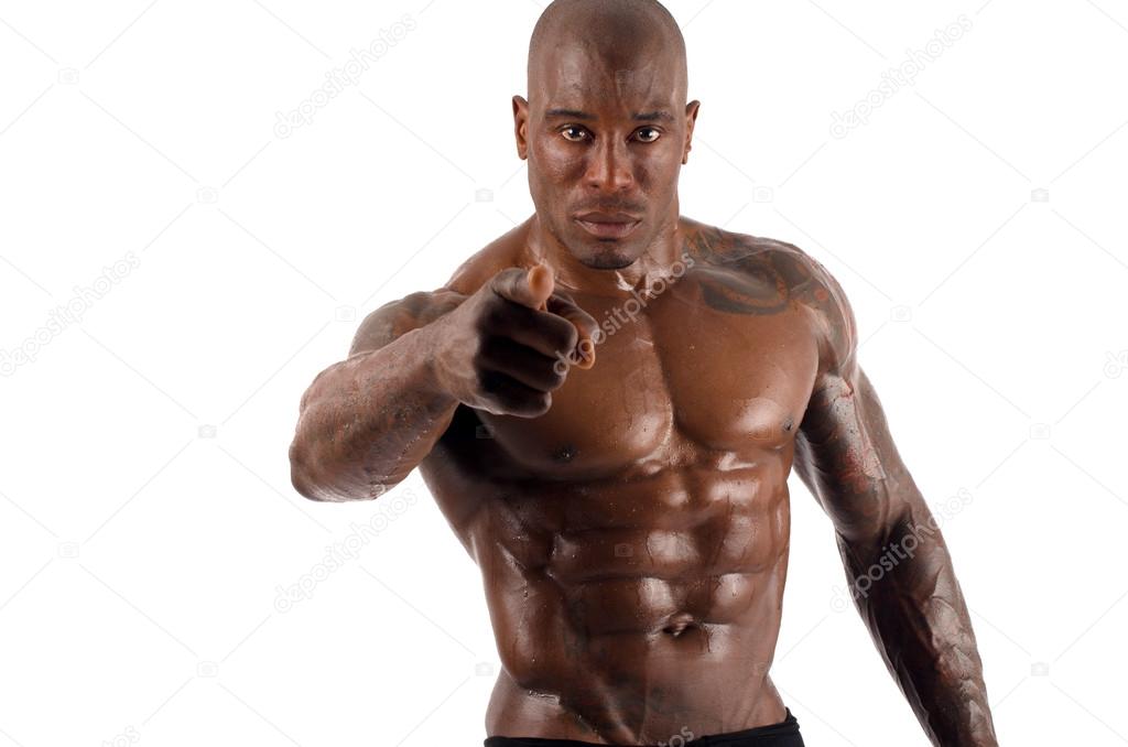 Black bodybuilder pointing to you and asking you to train harder. Strong man with perfect muscles. Isolated on white background
