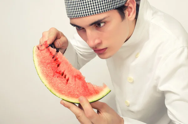 Chef cutting a green riped melon in perfect slices — Stock Photo, Image