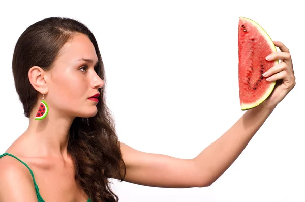 Beautiful woman posing with a green ripe melon slice — Stock Photo, Image