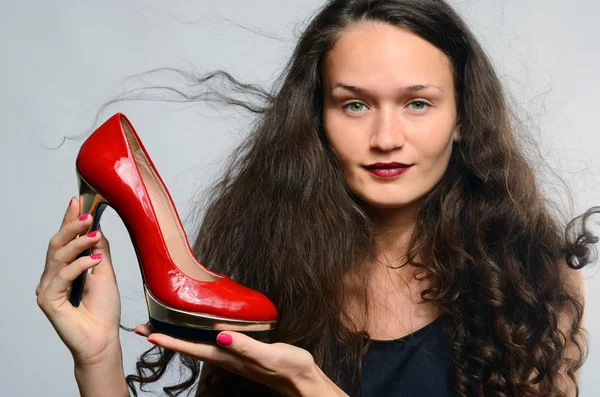 Beautiful woman in love with her high heels shoes — Stock Photo, Image