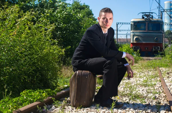 Businessman depressed after loosing his job tries to suicide on the railroad — Stock Photo, Image