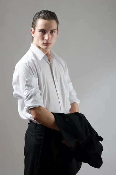 Young businessman holding his coat — Stock Photo, Image