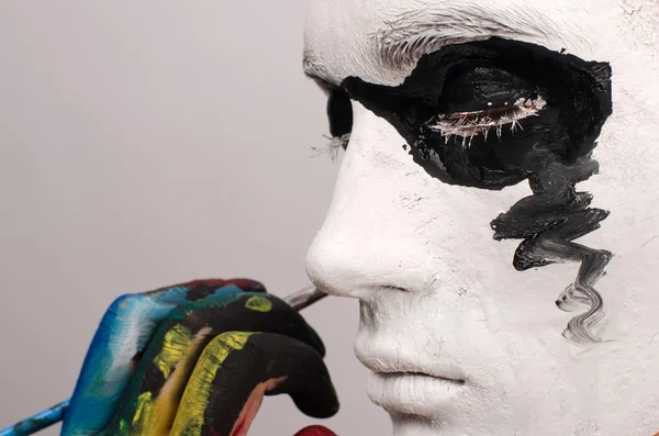 Beautiful young man painted on the face, preparing for Halloween — Stock Photo, Image