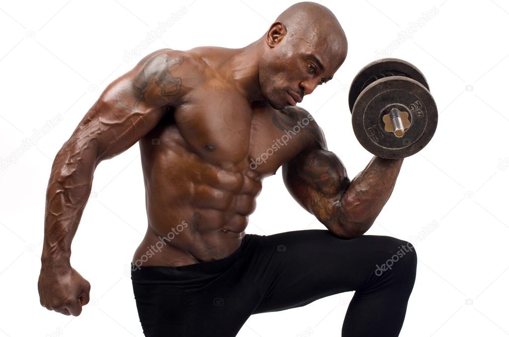 Black bodybuilder training with dumbbell. Strong man with perfect abs, shoulders,biceps, triceps and chest. Isolated on white background