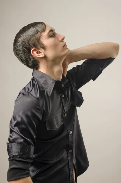 Profile of a beautiful young man dressed in a black shirt and thinking — Stock Photo, Image