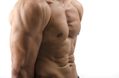 güçlü bir vücut geliştirmeci adam mükemmel abs, omuzlar, pazı, triceps ve göğüs kasların esneme ile