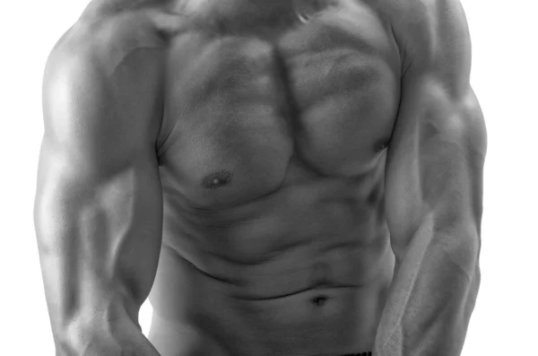 Hombre fuerte culturista con abdominales perfectos, hombros, bíceps, tríceps y pecho flexionando sus músculos —  Fotos de Stock