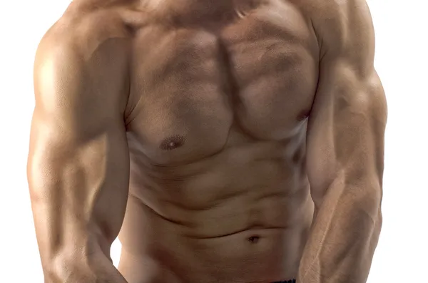 强的健美男子与完美的 abs、 肩膀、 肱二头肌、 肱三头肌和展示他的肌肉的胸部 — 图库照片