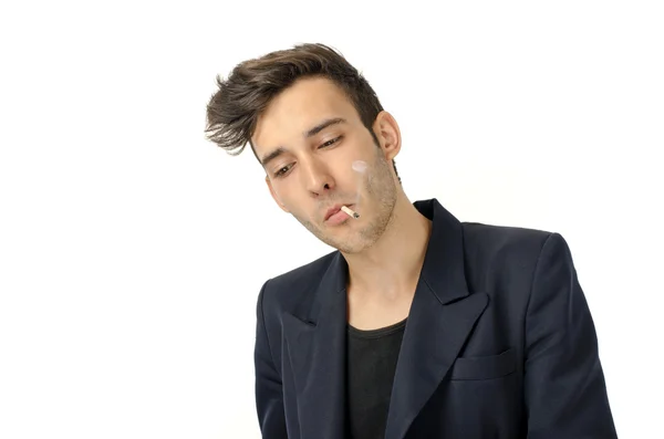 Young beautiful businessman smoking a cigar, tabacco addiction — Stock Photo, Image