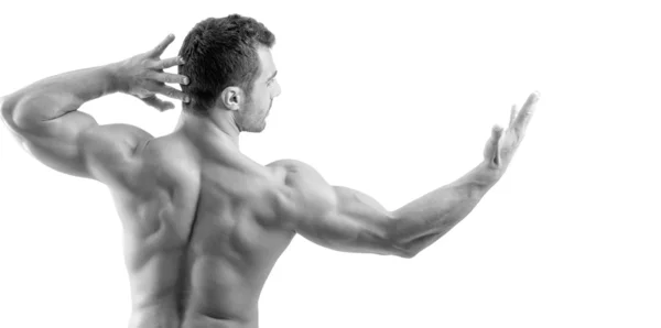 Bodybuilder showing his back muscles isolated on a white background — Stock Photo, Image