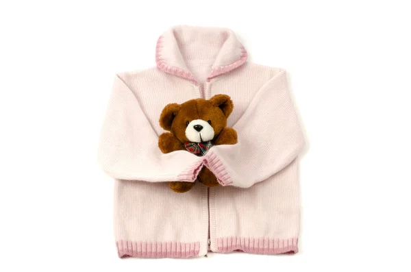 Close up van een baby roze blouse en een bruine teddybeer geïsoleerd — Stockfoto
