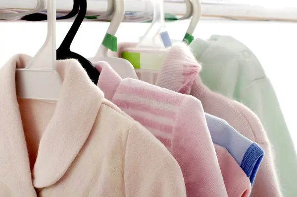 Close up of multiple blouses on a hanger isolated — Stock Photo, Image