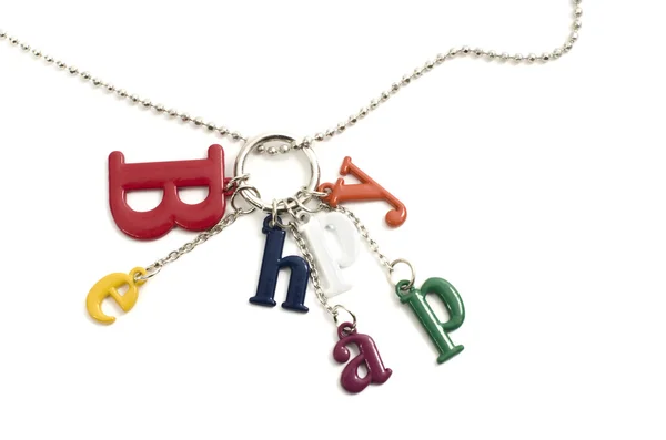 Nahaufnahme einer Halskette mit großen bunten Buchstaben isoliert — Stockfoto