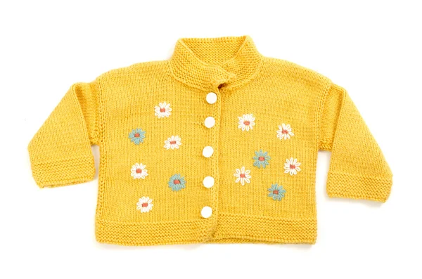 Close up of a baby yellow blouse with colorful flowers isolated — Stock Photo, Image