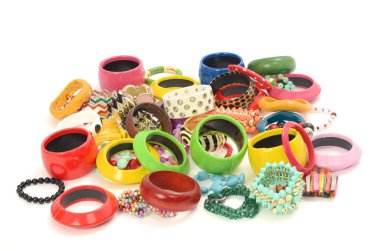 Close up on many and diversed colorful bracelets,beeing fashionable with different jewelery clipart