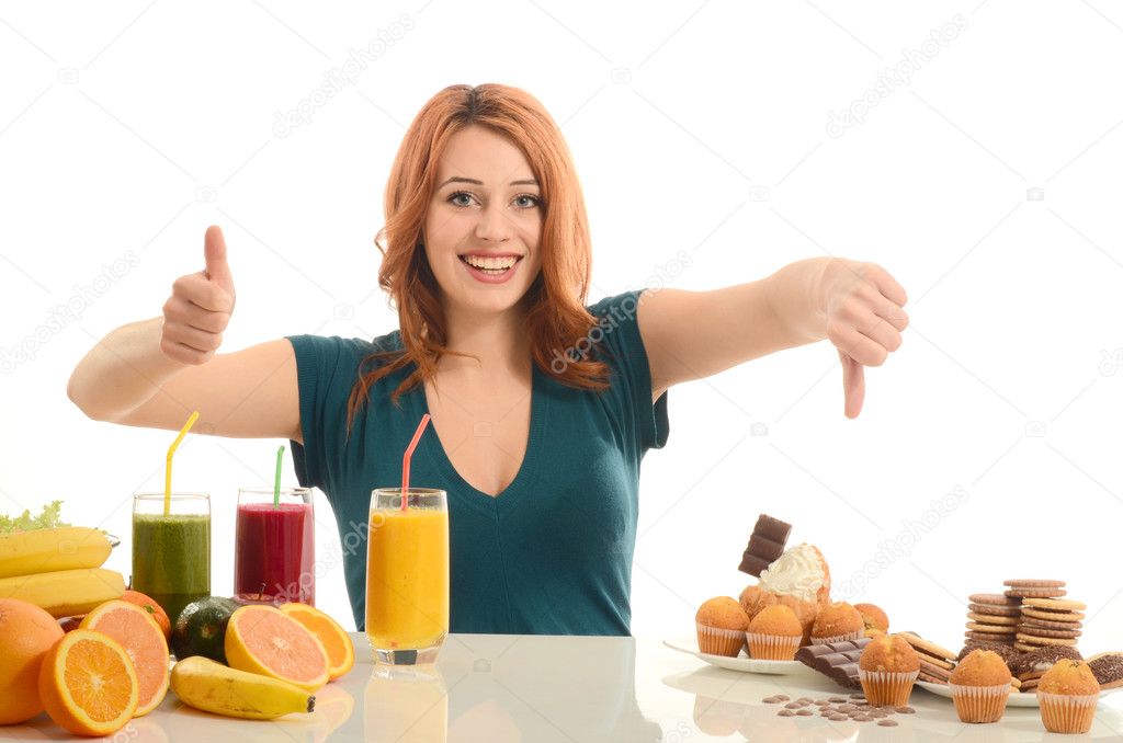 Woman choosing between fruits, smoothie and organic healthy food against sweets, sugar, lots of candies, unhealthy food