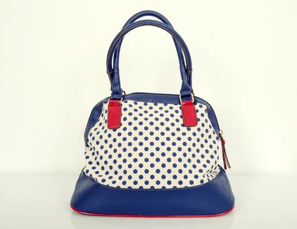 Navy blue polka dots purse. — Stock Photo, Image