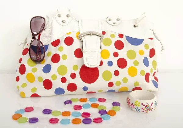 Big colorful polka dots bag with cute matching accessories. — Stock Photo, Image