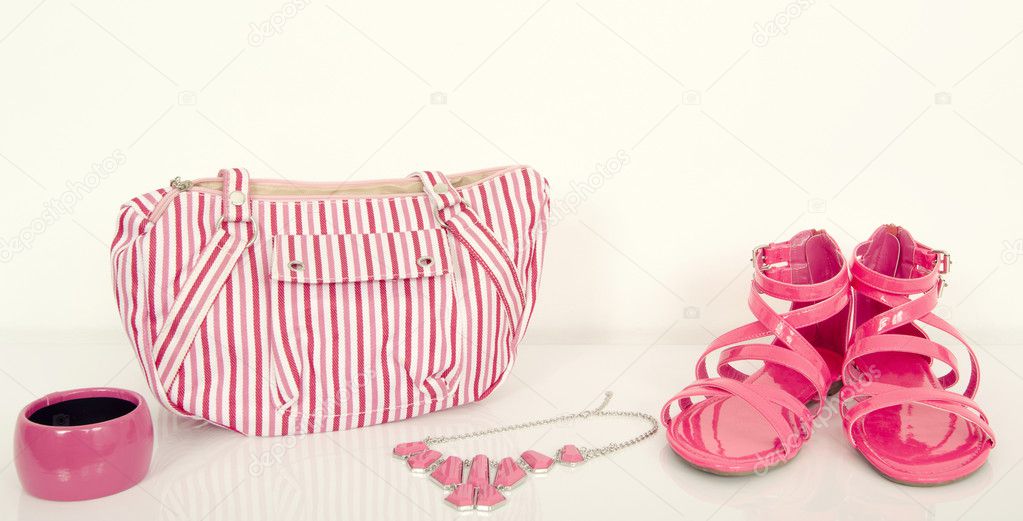 Pink summer woman accessories. Cute fucsia sandals with matching bag and jewellery.