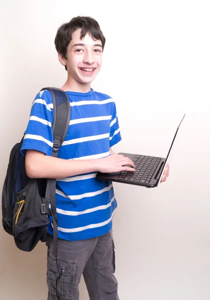 Teenage Student with backpack and computer — Stock Photo, Image