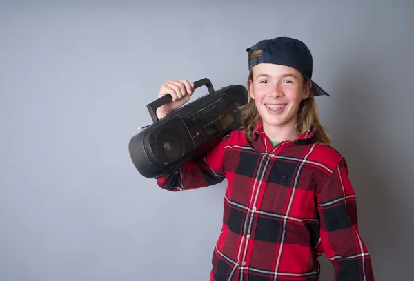 Happy smiling teen boy with boom box — Stock Photo, Image