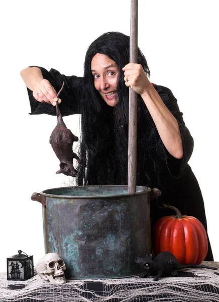 A witch brewing up a spell — Stock Photo, Image