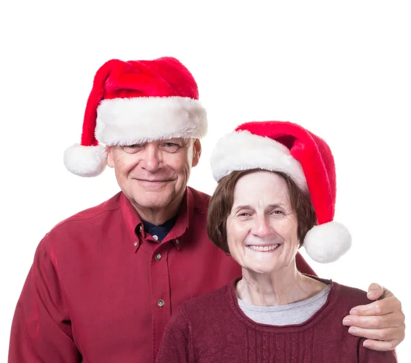 Happy Senior Couple in Christmas Santa hats — Stock Photo, Image