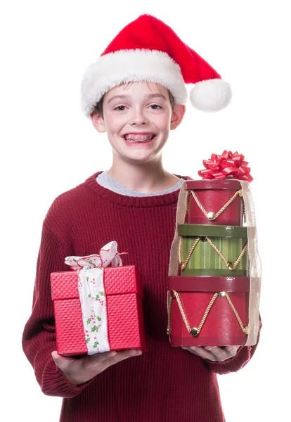 Happy Teen boy carrying Christmas gifts — Stock Photo, Image