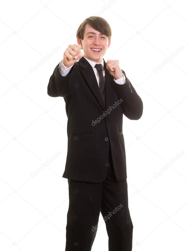 Happy teen boy in suit and tie goofing around