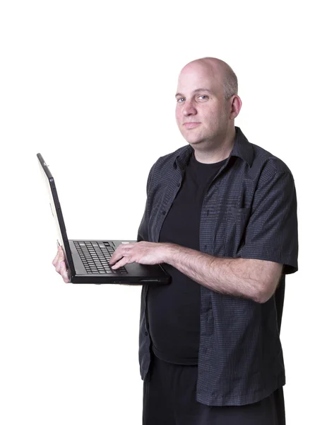 Middle aged man working with a laptop computer — Stock Photo, Image