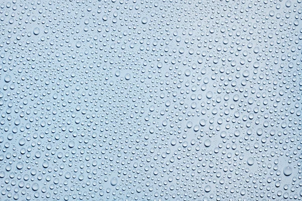 Mavi yüzeyde su damlaları