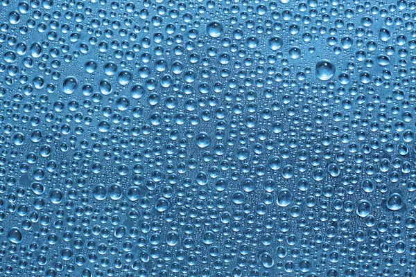 Krople wody na powierzchni niebieski — Zdjęcie stockowe