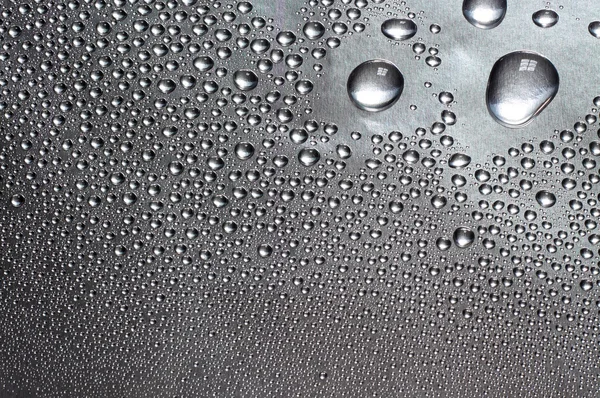 Water drops on silver surface — Stock Photo, Image