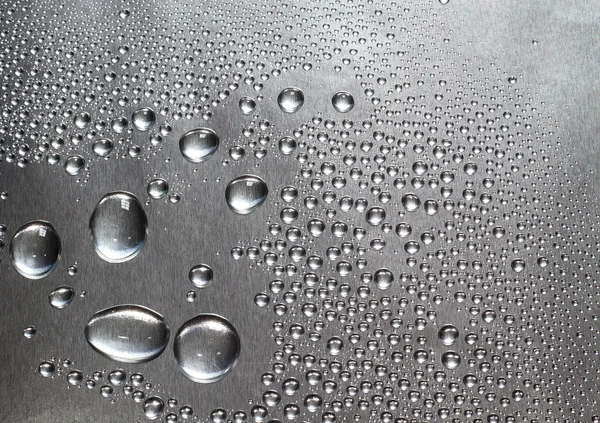 Water drops on silver surface — Stock Photo, Image