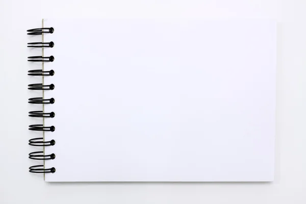 Cuaderno blanco aislado sobre fondo blanco — Foto de Stock