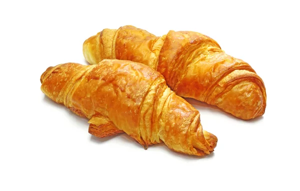 Dois croissant frescos, lançando sombra suave no branco. Delicioso. ! — Fotografia de Stock