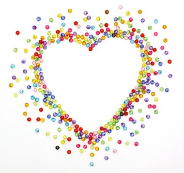 Colorful beads, heart shape space for photo or text isolated on