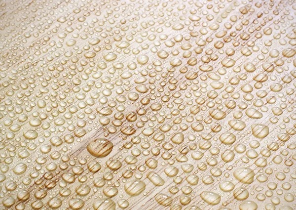 Water drops on a wooden surface. — Stock Photo, Image