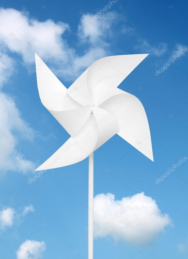 Toy windmill over blue sky
